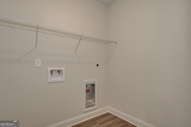 clothes washing area featuring washer hookup, hardwood / wood-style flooring, and electric dryer hookup