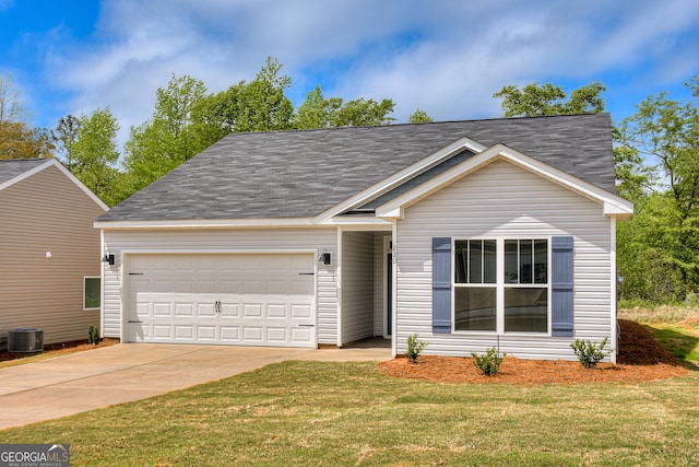 view of front of property featuring a front lawn, a garage, and central AC unit