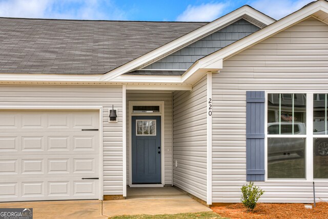 property entrance featuring a garage