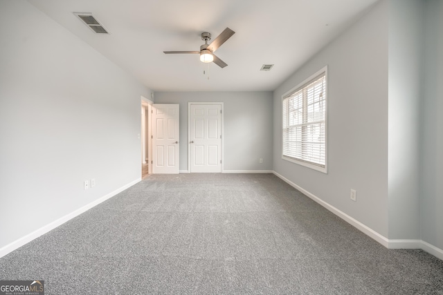 unfurnished bedroom with carpet floors and ceiling fan