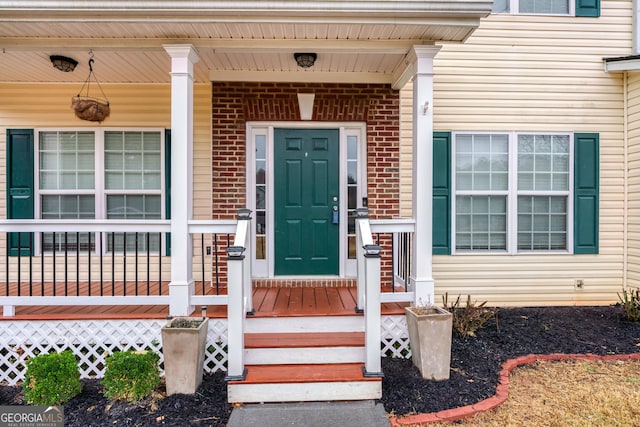 doorway to property featuring a porch