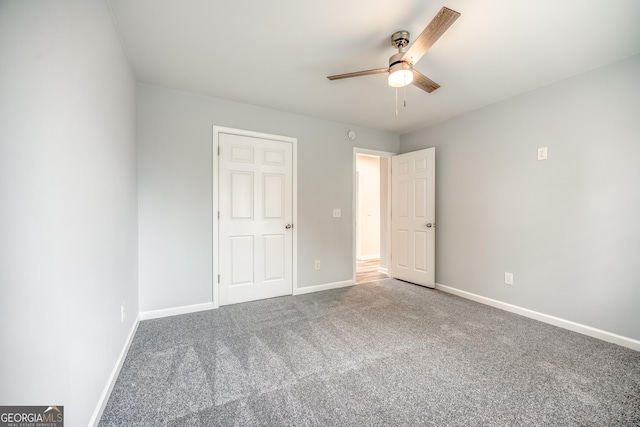 unfurnished bedroom featuring carpet floors and ceiling fan