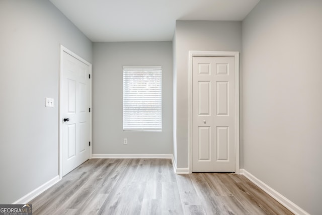 unfurnished bedroom with light hardwood / wood-style flooring