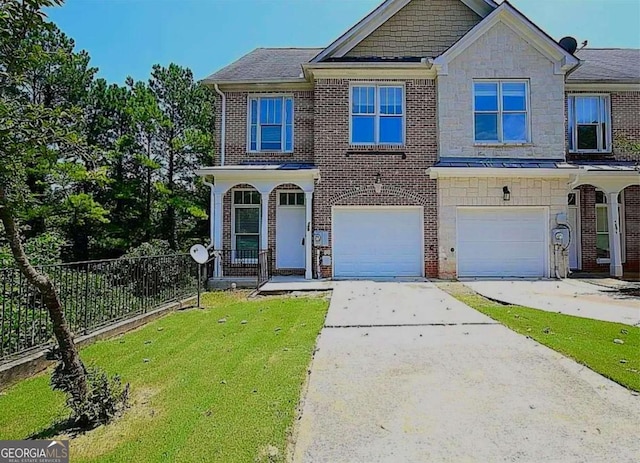 view of front of home featuring a garage and a front lawn