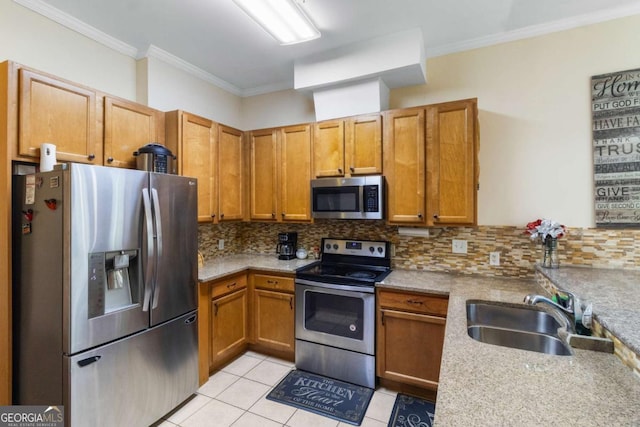 kitchen with appliances with stainless steel finishes, tasteful backsplash, light stone counters, ornamental molding, and sink