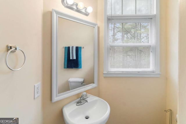 bathroom with toilet and sink