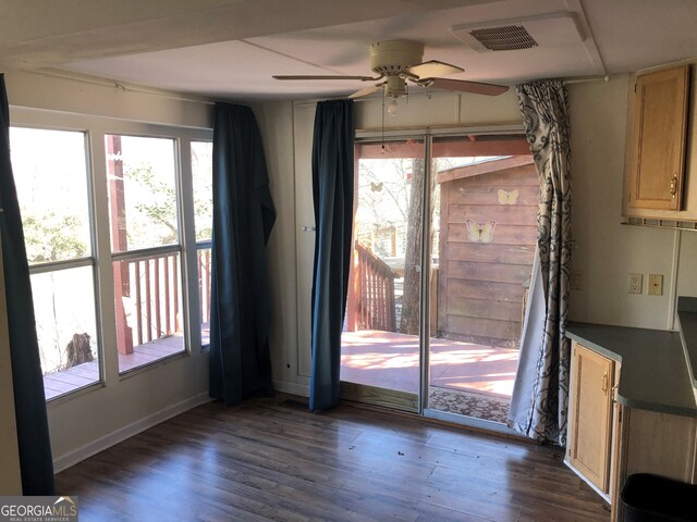 laundry area featuring a wealth of natural light, washer and dryer, sink, and dark hardwood / wood-style flooring