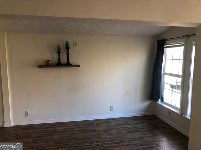 unfurnished dining area featuring dark hardwood / wood-style floors and ceiling fan