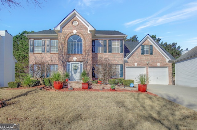 colonial home with a garage and a front lawn