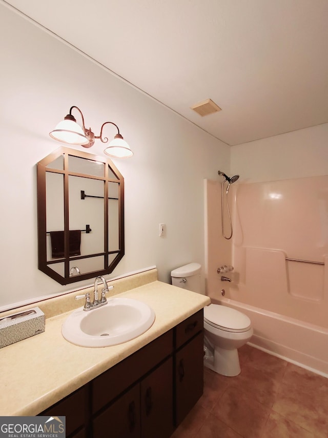 full bathroom featuring tile patterned floors, vanity, toilet, and shower / bath combination