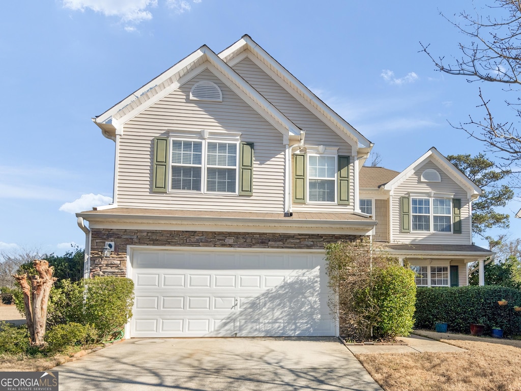 front facade with a garage