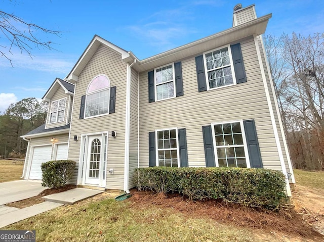 view of front of property with a garage