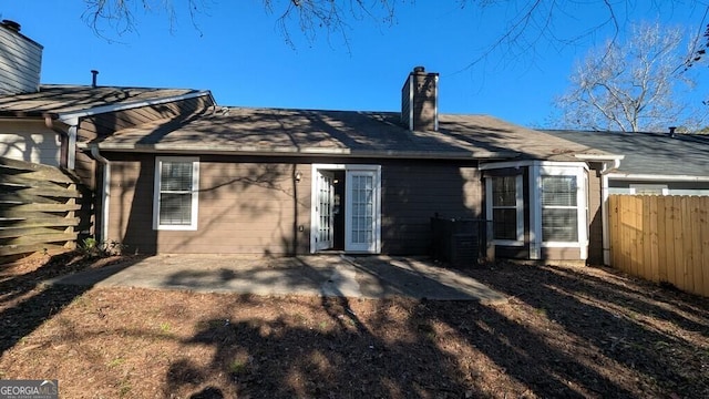 rear view of property featuring a patio area