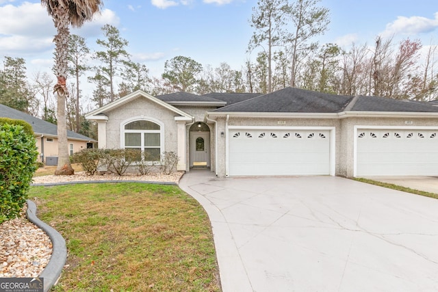 ranch-style home with a garage and a front lawn