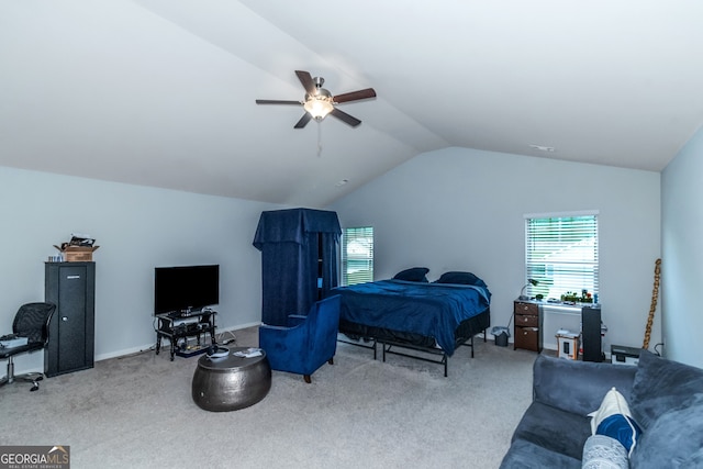 carpeted bedroom featuring ceiling fan and lofted ceiling