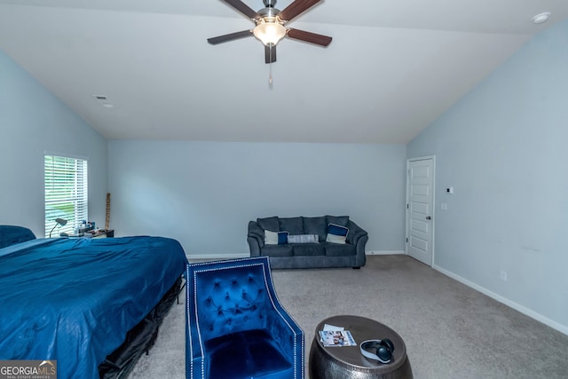 carpeted bedroom with ceiling fan and lofted ceiling