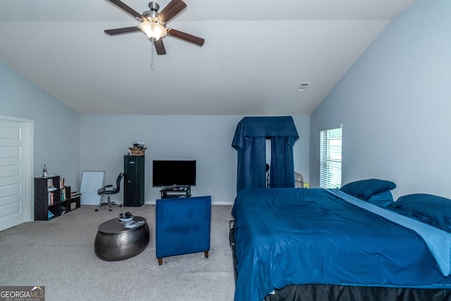 bedroom with carpet flooring, ceiling fan, and vaulted ceiling