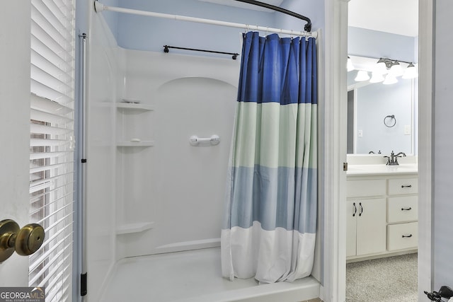 bathroom featuring a shower with curtain and vanity