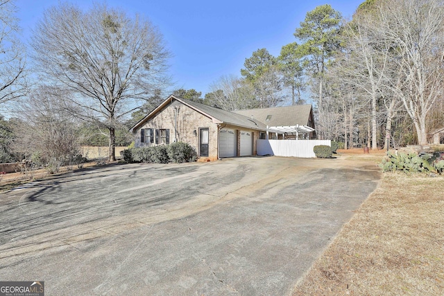 ranch-style home featuring a garage