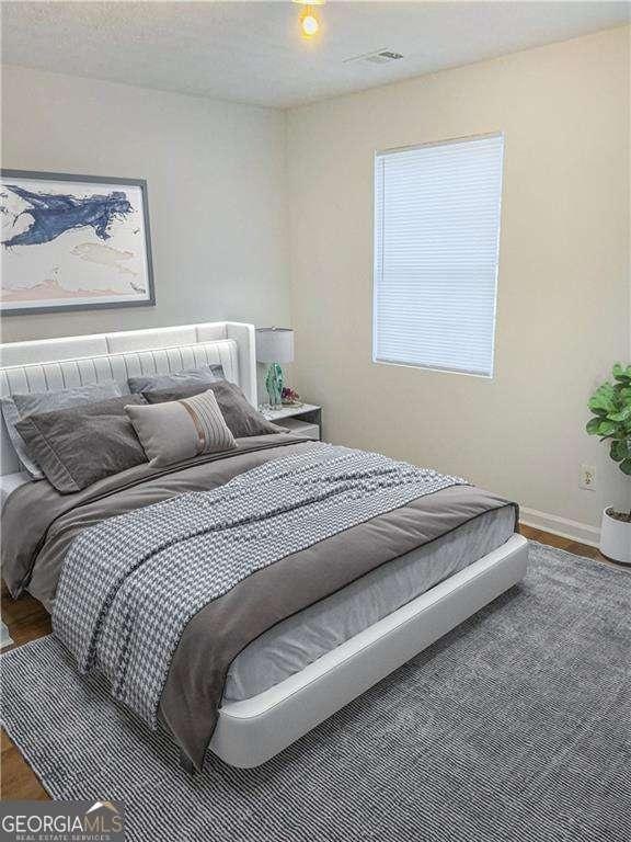 bedroom featuring hardwood / wood-style flooring