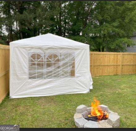 view of yard with a fire pit