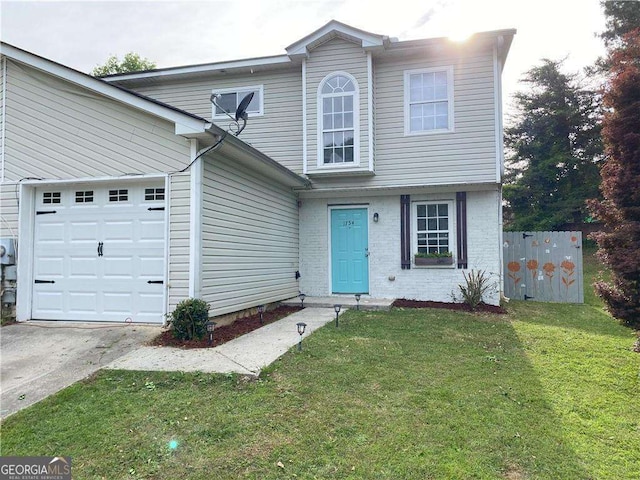 front facade featuring a front yard and a garage