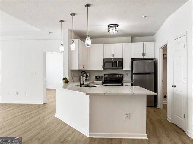 kitchen with stainless steel fridge, sink, electric range, decorative light fixtures, and white cabinetry