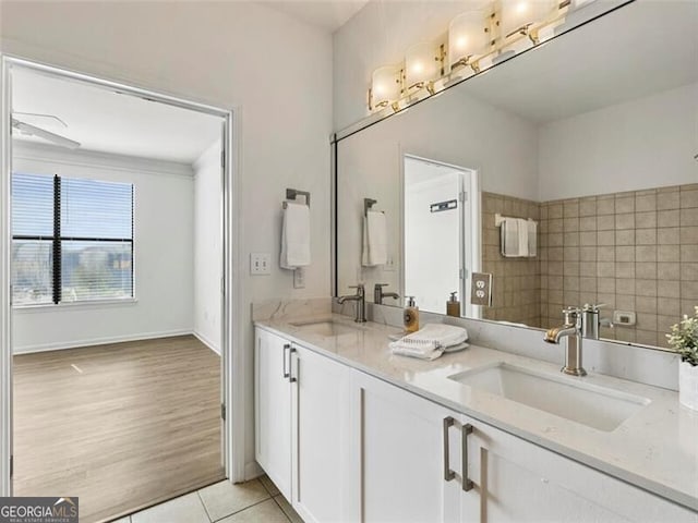 bathroom with tile patterned flooring and vanity