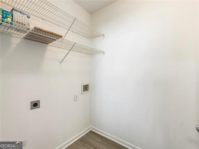 washroom with hookup for an electric dryer, hookup for a washing machine, and dark hardwood / wood-style floors