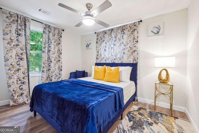 bedroom featuring ceiling fan and wood-type flooring