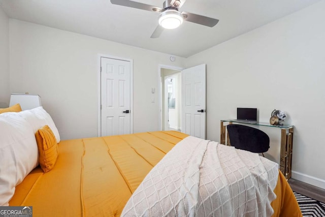 bedroom featuring hardwood / wood-style floors and ceiling fan