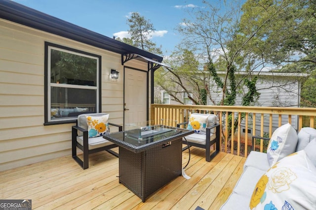 wooden deck featuring an outdoor hangout area