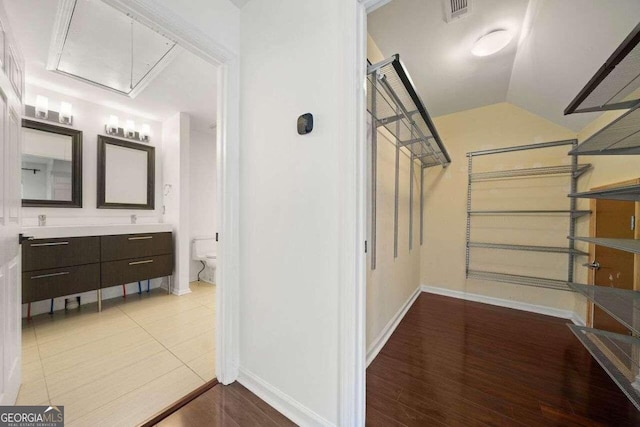 interior space featuring hardwood / wood-style floors and vaulted ceiling