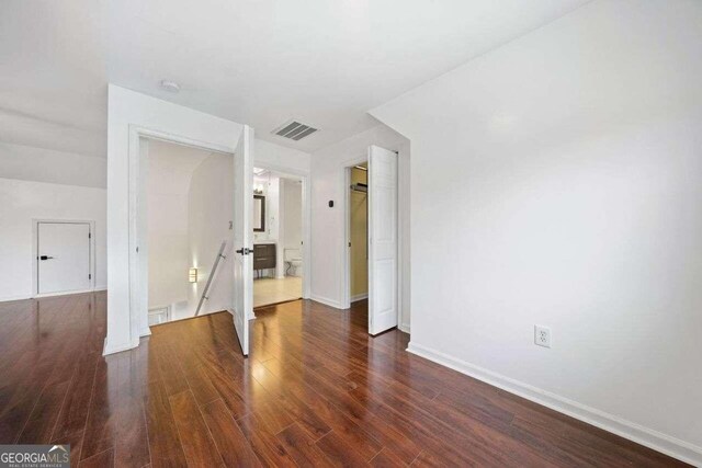 unfurnished bedroom featuring dark hardwood / wood-style floors