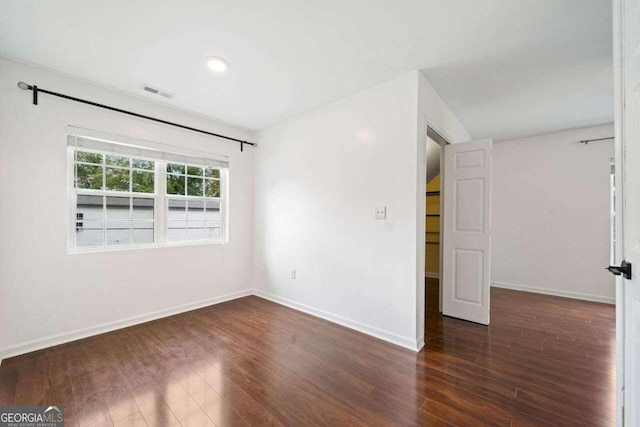 empty room featuring dark hardwood / wood-style floors