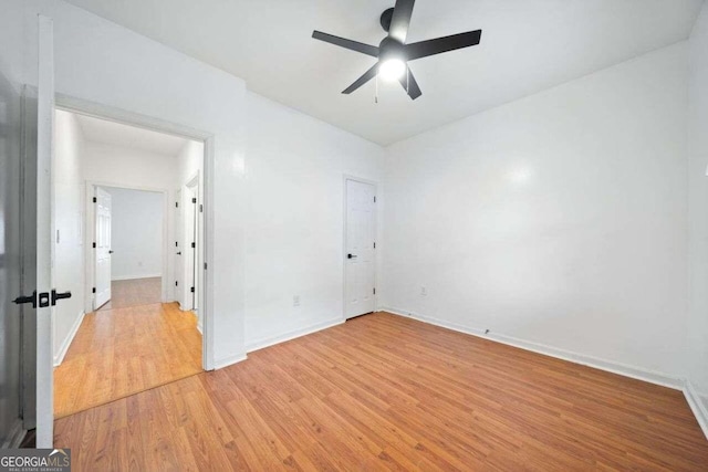 unfurnished bedroom featuring ceiling fan and light hardwood / wood-style flooring