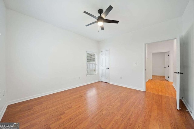 unfurnished bedroom featuring light wood-type flooring and ceiling fan