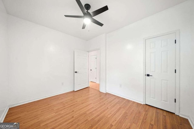 unfurnished bedroom featuring ceiling fan and light hardwood / wood-style floors