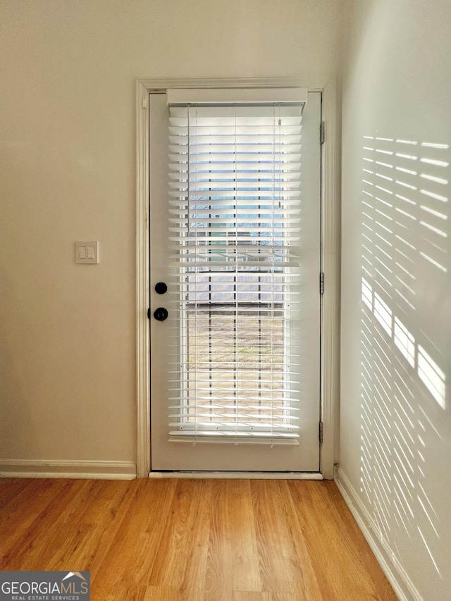 doorway featuring light wood-type flooring