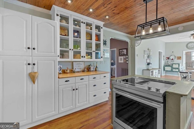 kitchen featuring wood ceiling, stainless steel electric range, pendant lighting, and crown molding