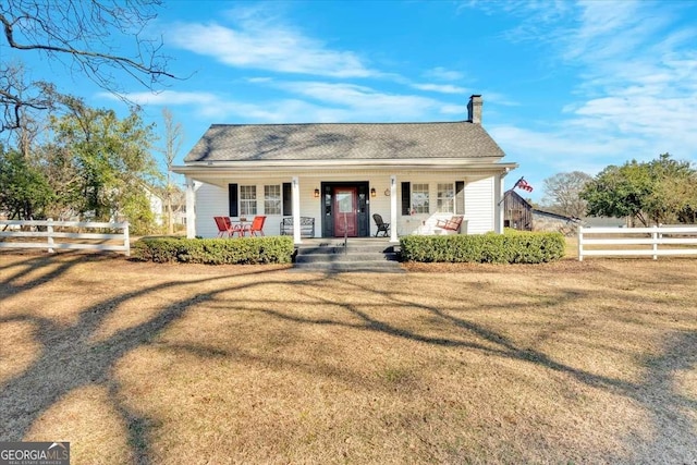 bungalow-style house featuring a front yard and a porch