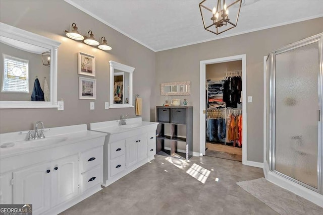 bathroom with finished concrete flooring, a shower stall, ornamental molding, and vanity