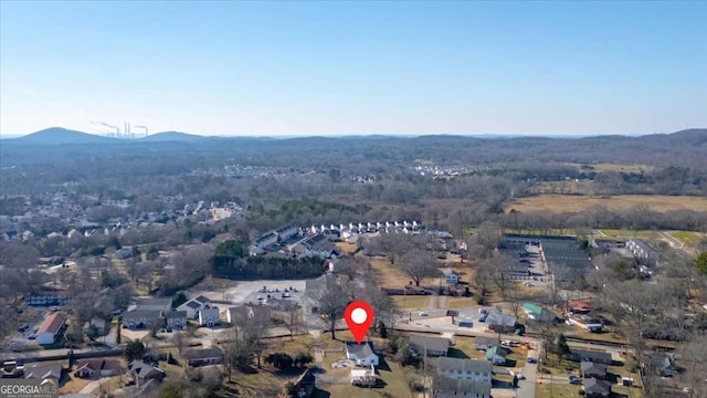 birds eye view of property featuring a mountain view