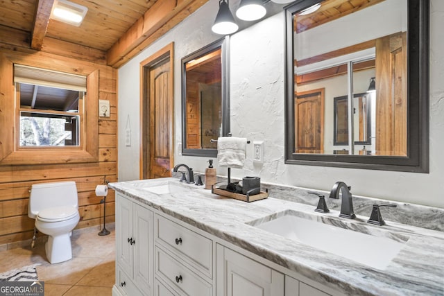 bathroom featuring vanity, wooden ceiling, tile patterned flooring, toilet, and beam ceiling