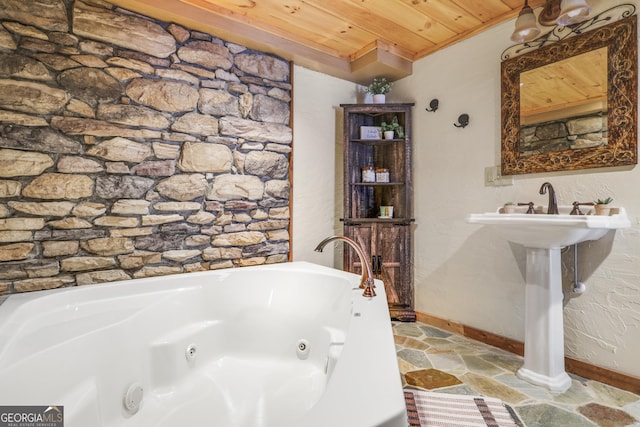 bathroom with a bathtub and wooden ceiling