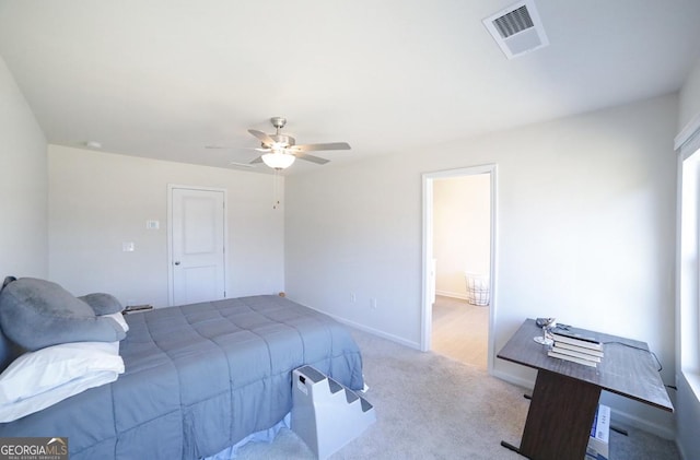 bedroom featuring ceiling fan and light colored carpet