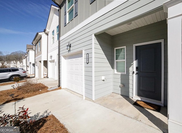 view of exterior entry featuring a garage