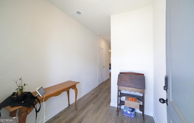 hall with light hardwood / wood-style floors