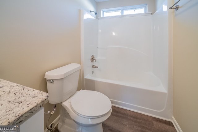 full bathroom with vanity, toilet, shower / tub combination, and wood-type flooring