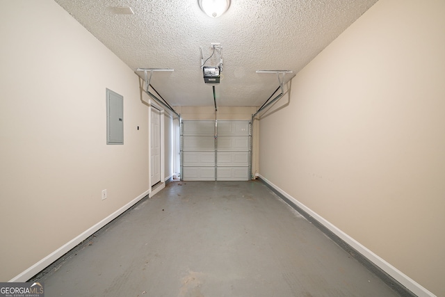 garage with electric panel and a garage door opener